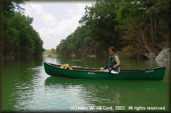 Marc McCord paddling the Blanco River during the flood of 2002