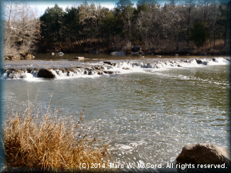 Looking upriver at the ledge at Hughes Crossing from river right