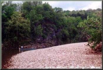 Another gravel beach fronted by high bluffs