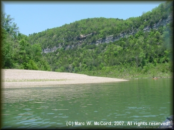 Large gravel bars on one side and high cliffs on the other typify the Buffalo