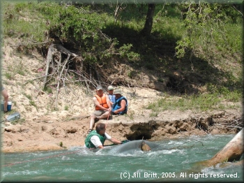Marc McCord rescueing a pinned kayak