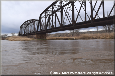 The railroad bridge is the last trace of development along this reach of the Gunnison River