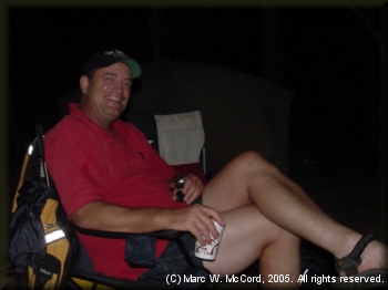 Steve Crowe relaxing at a riverside campsite on the LMF