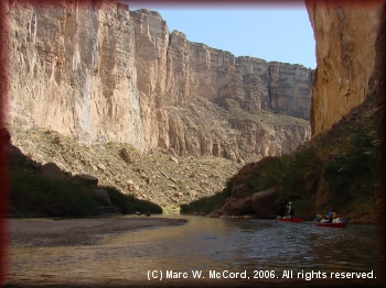 Majestic canyon walls rise from the river to awe paddlers